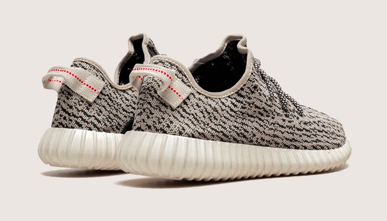 adidas Yeezy Boost 350 "Turtle Dove" product image of grey and black fabric sneakers with white Boost midsoles.