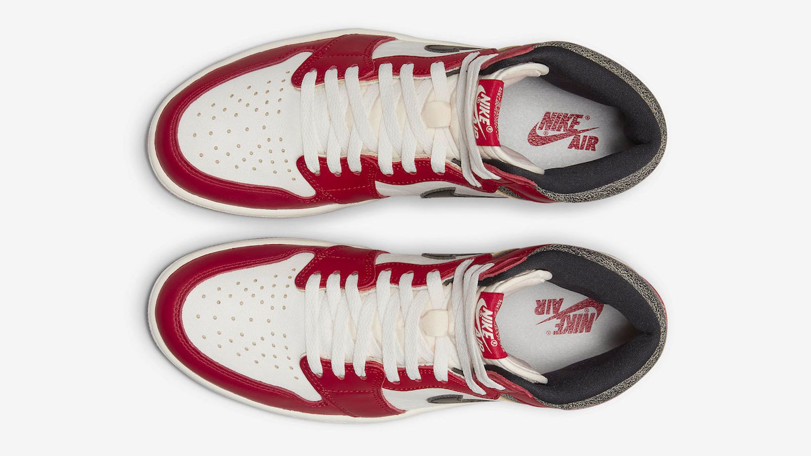 Air Jordan 1 "Chicago" product image of a white, red, and black leather sneaker.