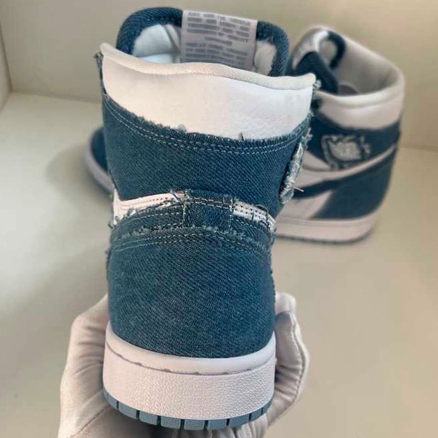 Air Jordan 1 "Denim" leaked image of a white pair of sneakers covered in denim overlays.