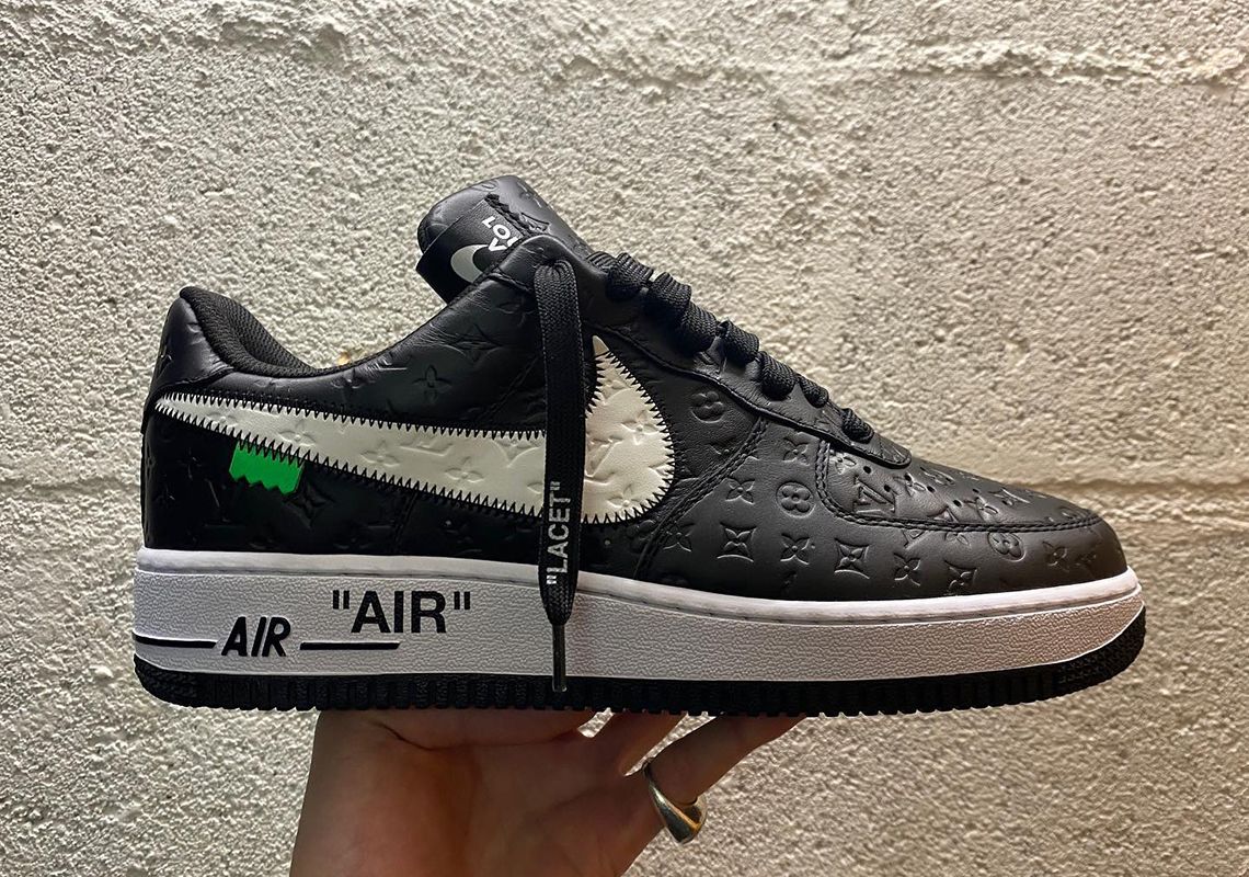 Louis Vuitton x Off-White x Nike Air Force 1 product image of a black and white LV debossed sneaker.