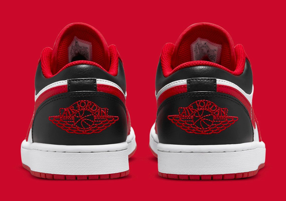 Air Jordan 1 Low "Reverse Black Toe" product image of a white sneaker with black and red overlays.