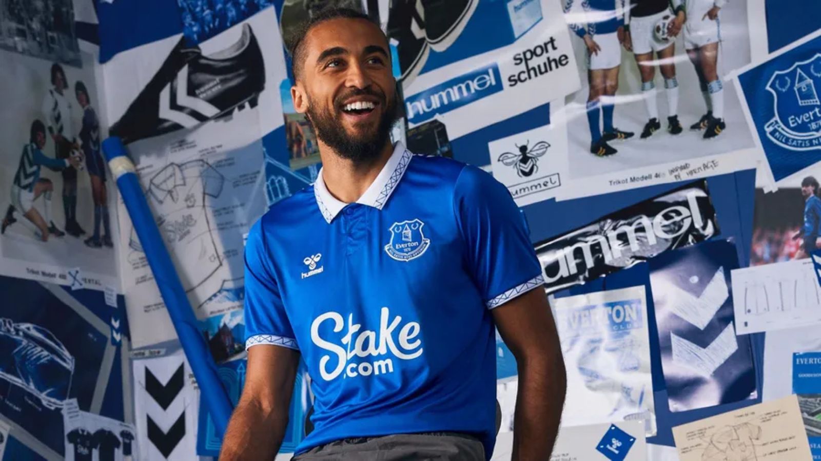 Everton hummel Home Kit product image of Calvert-Lewin wearing a blue jersey with a white collar featuring a geometric pattern.