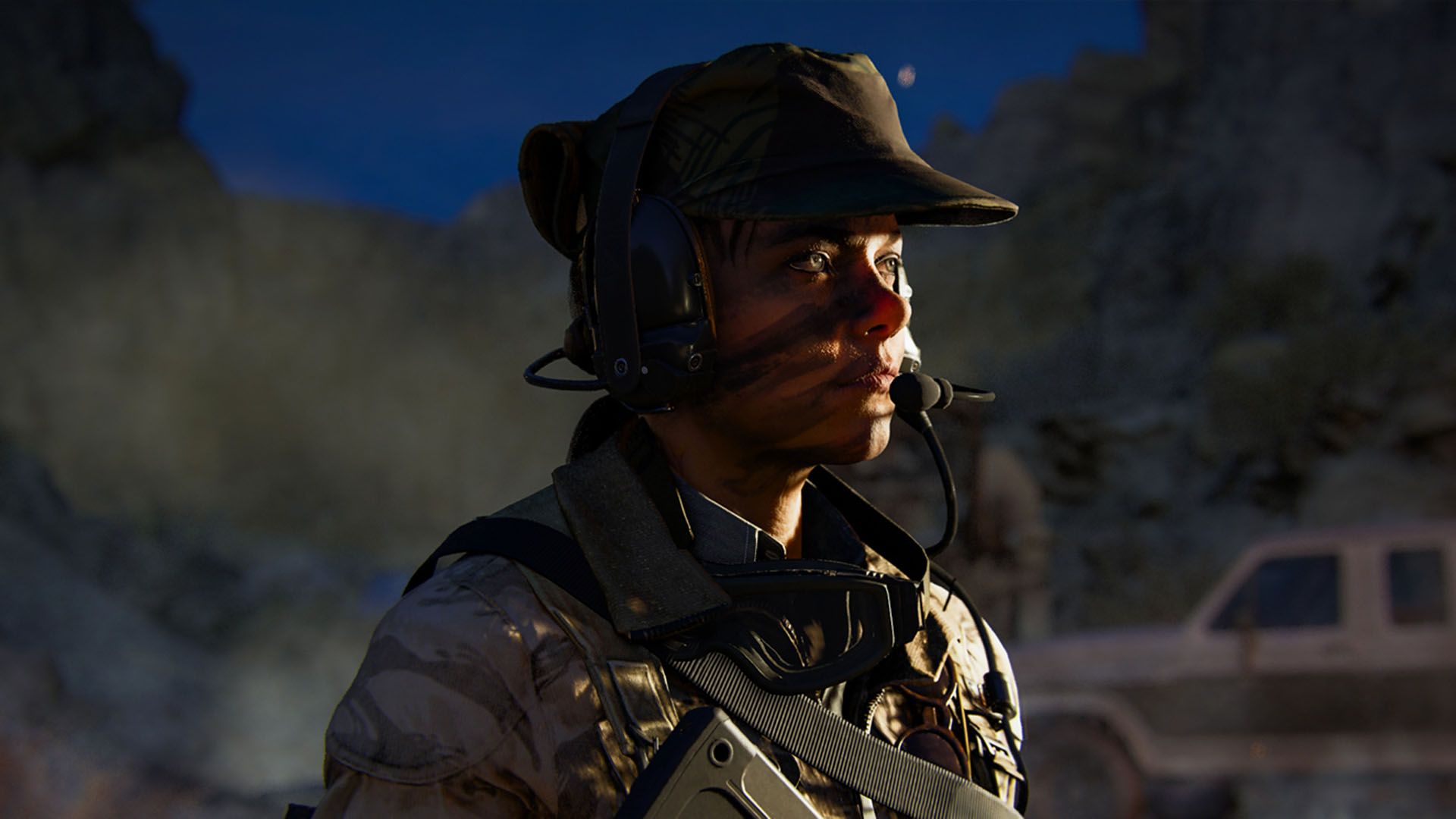 Black Ops 6 Operator wearing a military uniform and headset with a pick-up truck in background