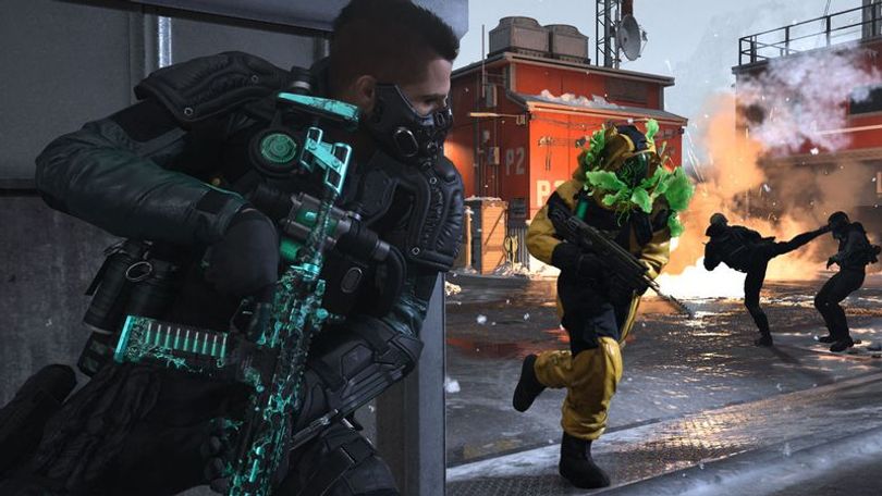 Modern Warfare 3 Soap Operator taking cover behind a wall while holding an assault rifle. Players are fighting in front of fire in background