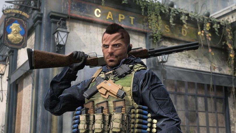 Warzone Soap Operator holding shotgun on shoulder in front of British pub