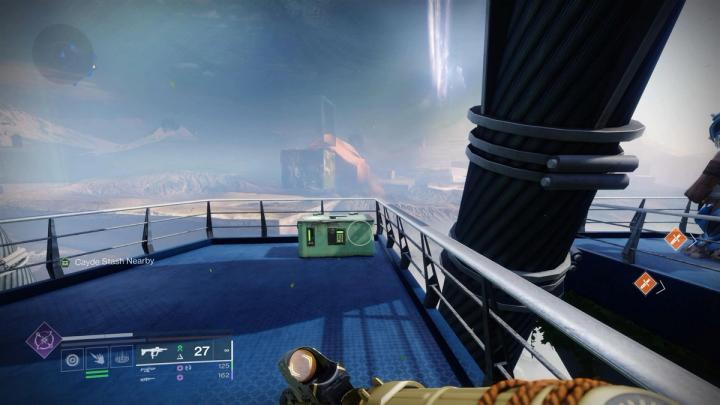 A chest near the edge of a map with metal structures in the background in Destiny 2