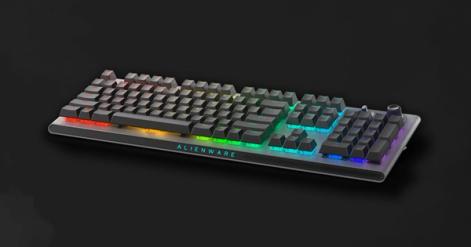 A black, raised Alienware gaming keyboard with RGB lighting below its mechanical keys.