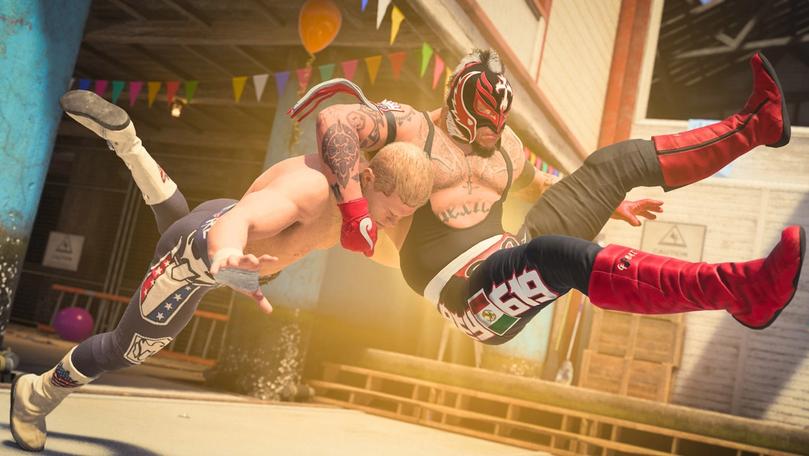 two wrestlers are wrestling in a ring in a video game .