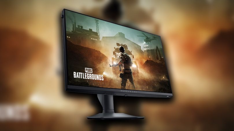 A black gaming monitor with PUBG Battlegrounds cover art on the display.