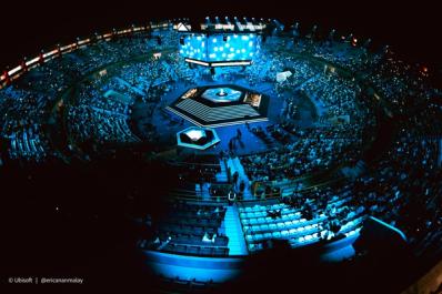 an aerial view of a stadium filled with people at night .