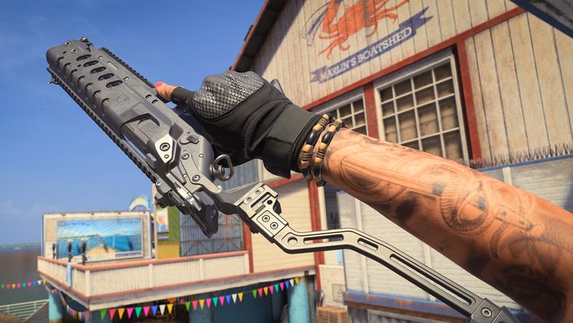 MW3 player holding the Static HV SMG at arm's length with a boatshed in the background