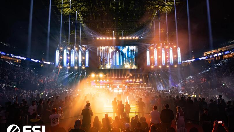 a crowd of people are watching a concert in a stadium .