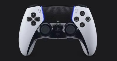 PlayStation DualSense Edge product image of a white and black controller featuring blue lighting for trim.