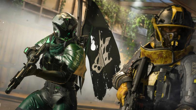 MW3 player carrying a flag on their back while holding a gun. A teammate wearing a yellow outfit 