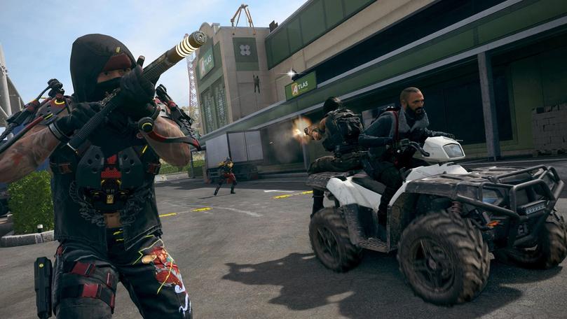 Warzone player aiming gun with player riding an ATV with teammate firing gun while sitting on the back