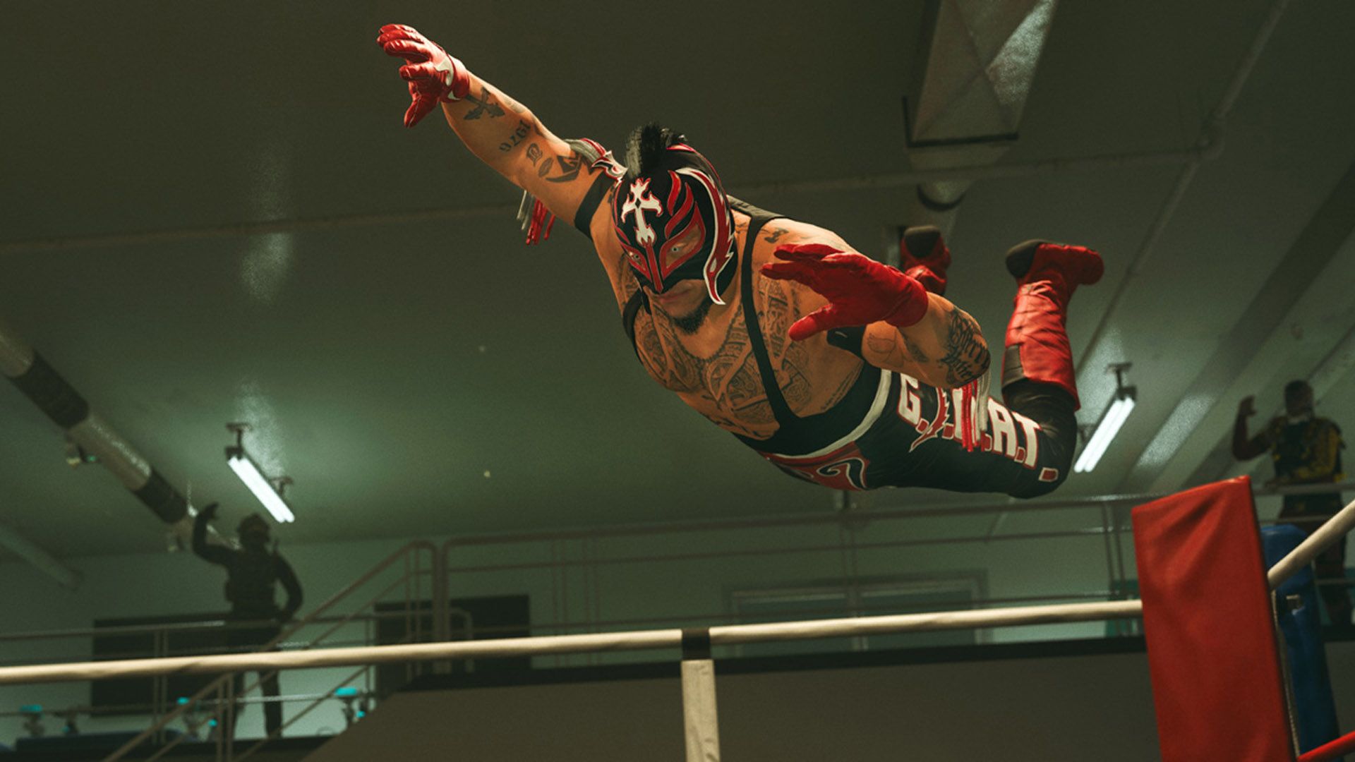 a wrestler is flying through the air in a wrestling ring .