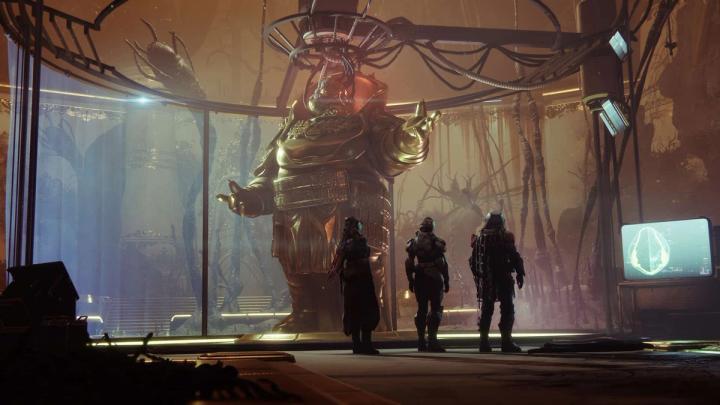 Three futuristic looking soldiers stare at a massive statue