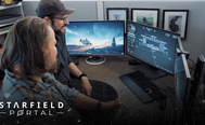 Two developers sit at a computer using shipbuilder