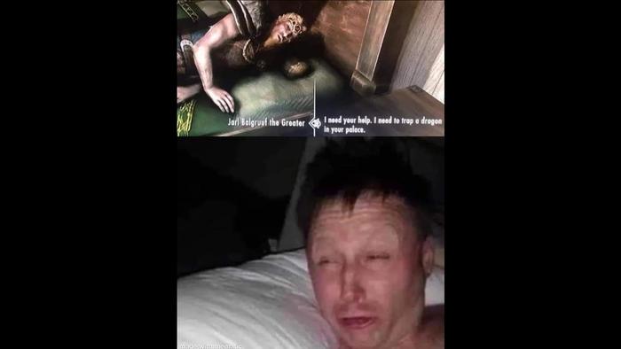 a man is laying on a bed next to a video game character .