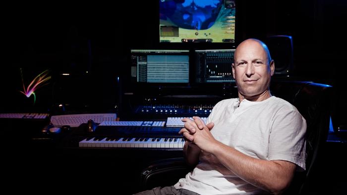 Inon Zur sits in a music studio