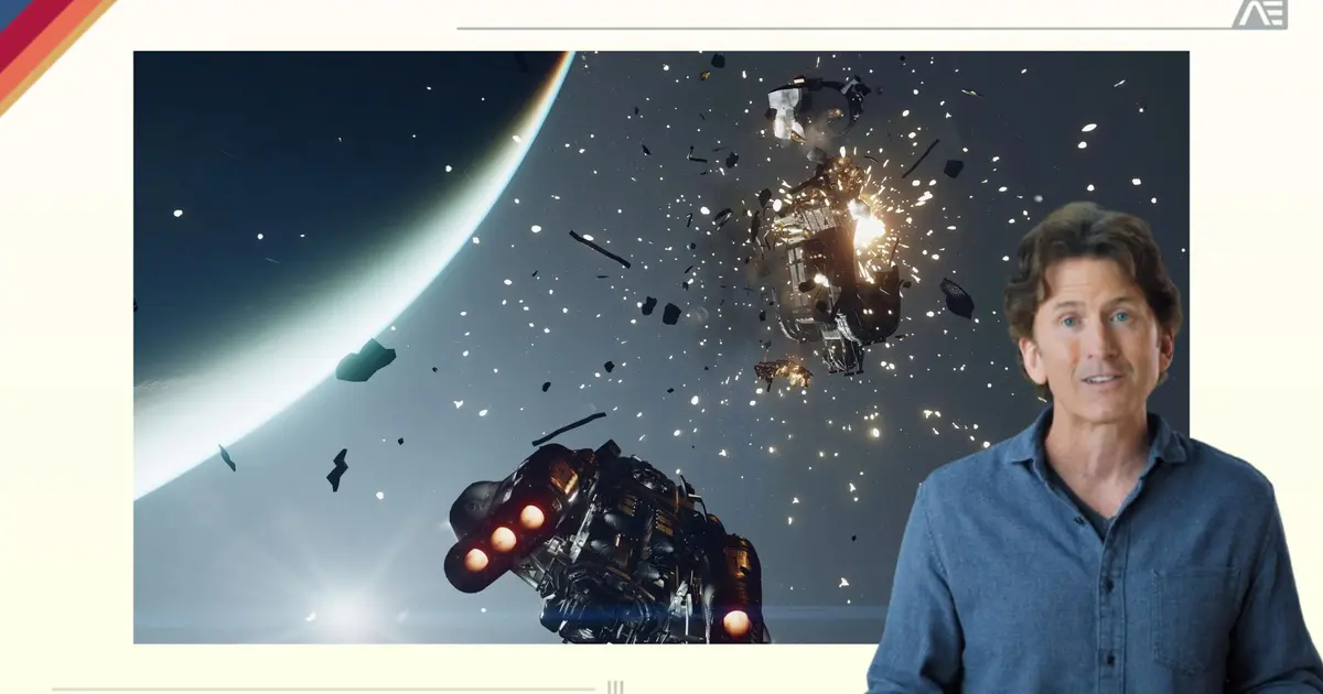 a man is standing in front of a screen with a picture of a space ship in the background .