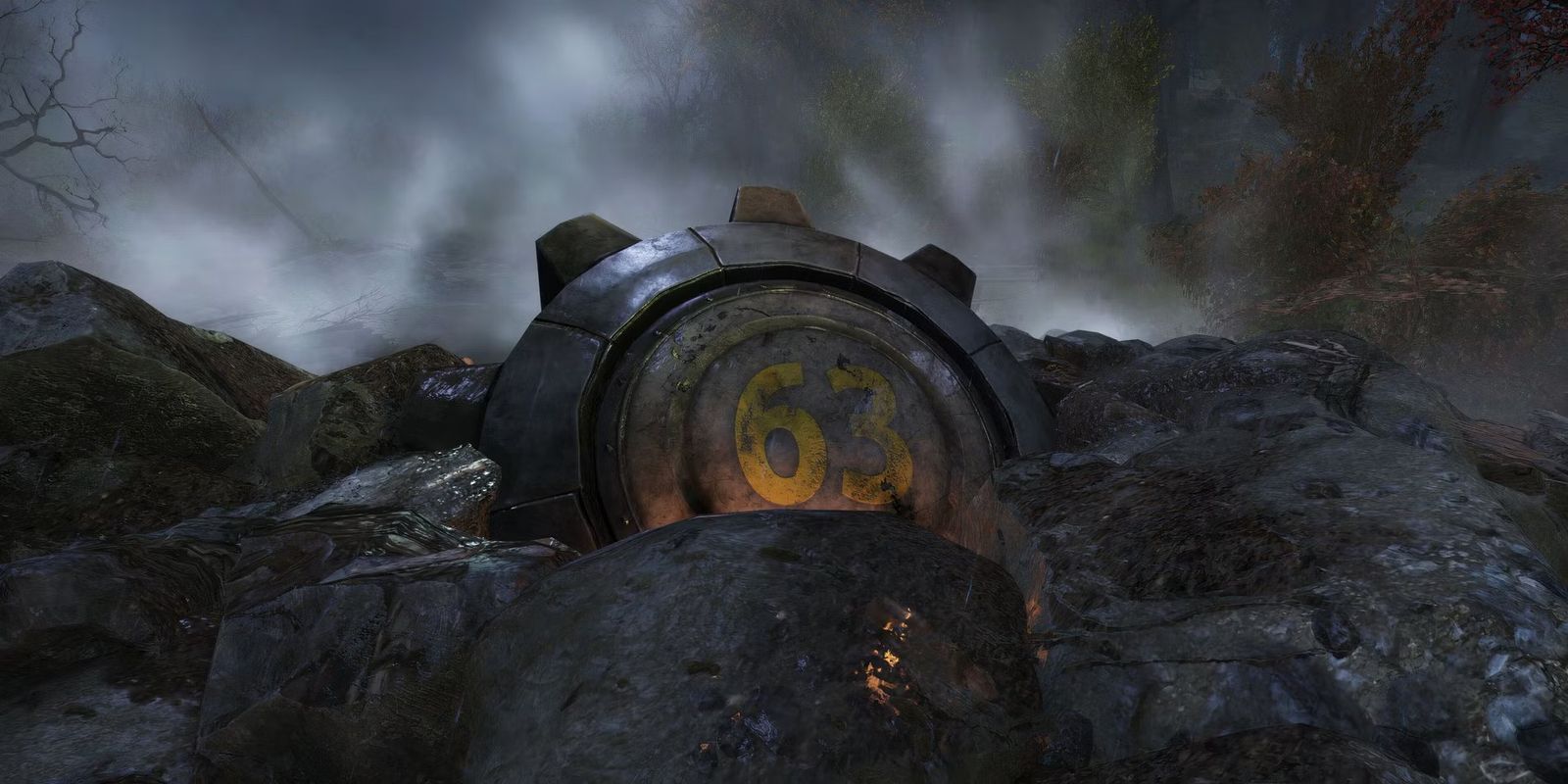 a vault door is sitting on top of a pile of rocks .