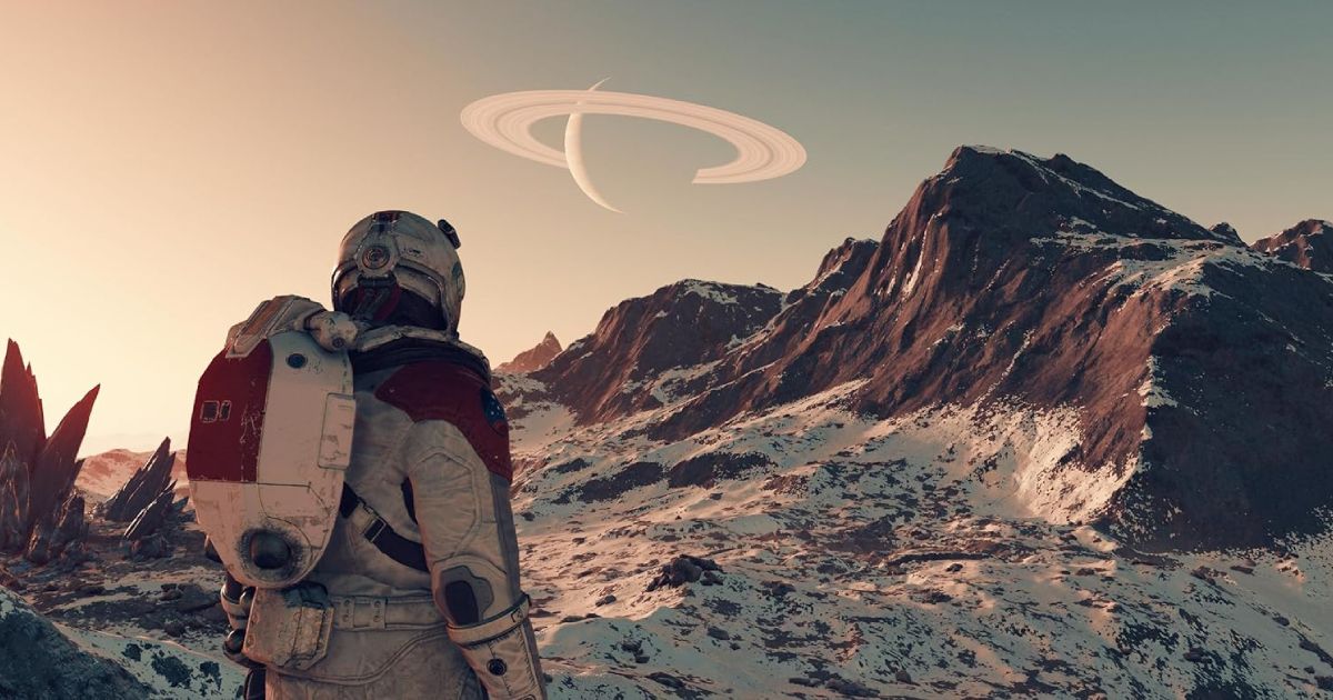 Someone in a white and orange space suit looking up at a snowy mountain with a planet with rings around it in the sky.