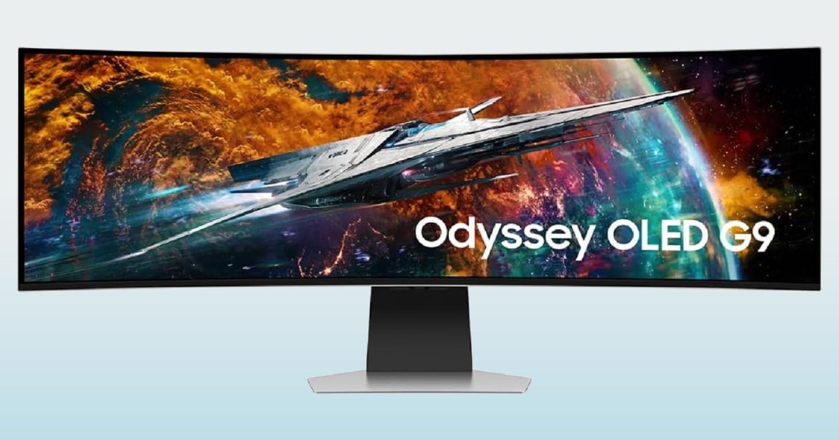A dark grey and black near-frameless ultrawide monitor with an image of a spaceship on the display.