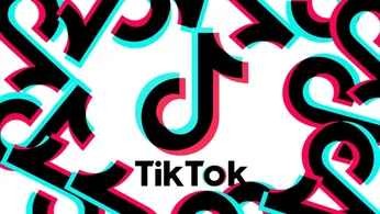 TikTok logo in front of a white background and with other TikTok logos surrounding it.
