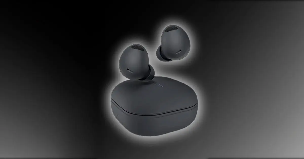 A Graphite-colored pair of wireless earbuds above their charging case, all of which features a white glow around it.