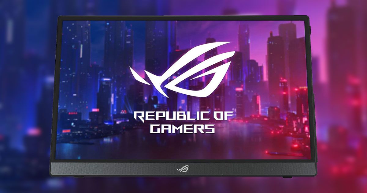 A dark gray and black portable monitor with Republic of Gamers branding in white on the display in front of a dark blue and purple city landscape.