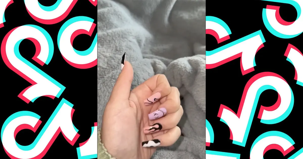 An image of newly done nails from the viral TikTok “New Nails and Kitty” video featuring Lily Natty showing off her new nails