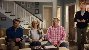 Phil, Claire, Cameron and Mitchell from Modern Family in the Dunphy household for a WhatsApp advert
