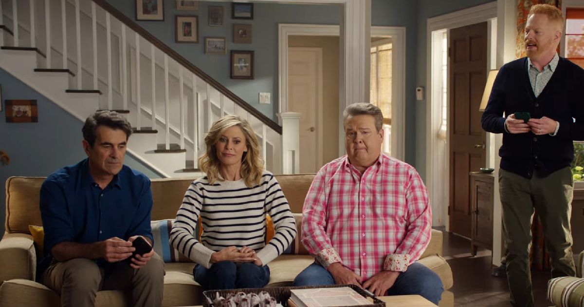 Phil, Claire, Cameron and Mitchell from Modern Family in the Dunphy household for a WhatsApp advert