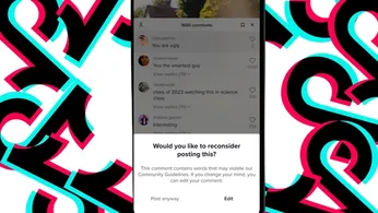 An iPhone screen with a TikTok pop-up warning a user that posting comments may violate guidelines, and the iPhone is surrounded by TikTok logos in front of a white background