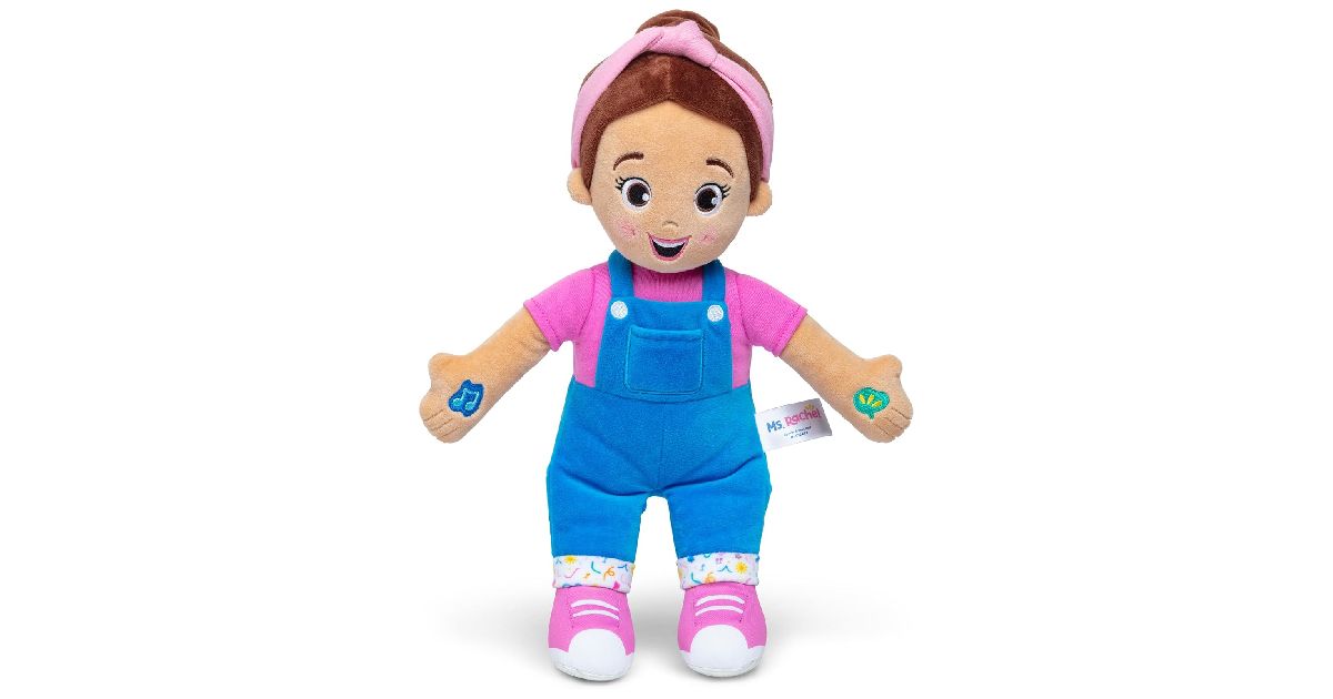 Ms. Rachel Speak & Sing Doll wearing a pink top with blue dungarees.